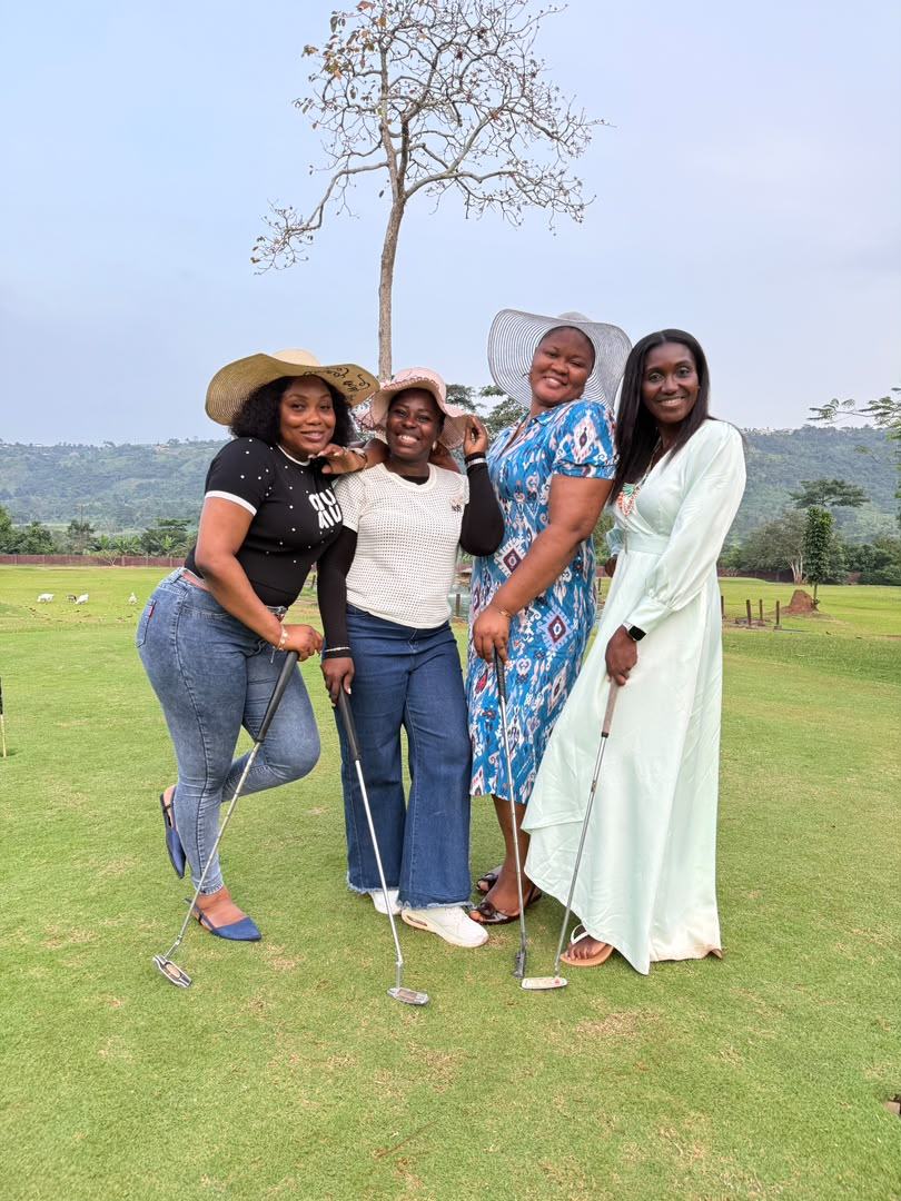Four ladies from the 2025 retreat posing together on a lawn in sun hats.