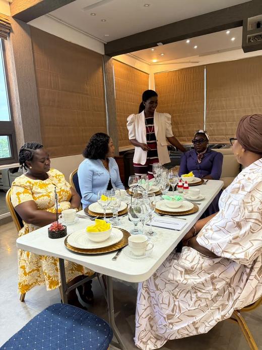 Guests seated at a formally laid table during the dining etiquette session.